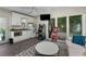 Large sunroom with a wet bar, natural light and an arcade machine at 5219 Legendary Ln, Acworth, GA 30102