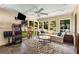 Sunroom features bright light, neutral paint, and fun decor at 5219 Legendary Ln, Acworth, GA 30102