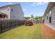 Spacious, green backyard with privacy fence and mature landscaping at 1374 Highland Wood Ct, Auburn, GA 30011