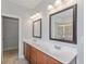 Bright bathroom boasts double sink vanity, large mirrors, and a walk in closet at 1374 Highland Wood Ct, Auburn, GA 30011