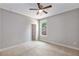 This bedroom offers a ceiling fan, natural light and access to a walk in closet at 1374 Highland Wood Ct, Auburn, GA 30011