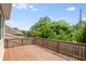 Well-maintained wooden deck is perfect for entertaining or relaxing in your backyard at 1374 Highland Wood Ct, Auburn, GA 30011