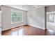 Cozy dining area with hardwood floors, a modern light fixture, and ample light at 1374 Highland Wood Ct, Auburn, GA 30011