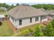 Well-maintained home exterior featuring a screened porch and back deck at 1374 Highland Wood Ct, Auburn, GA 30011