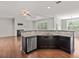 Kitchen with granite counters, dark cabinets, and stainless steel appliances at 1374 Highland Wood Ct, Auburn, GA 30011