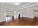 Spacious living room with hardwood floors and tray ceiling at 1374 Highland Wood Ct, Auburn, GA 30011