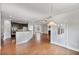 Open concept living space with kitchen, living room and breakfast area, hardwood floors at 1374 Highland Wood Ct, Auburn, GA 30011