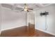 Versatile living space with hardwood floors, coffered ceiling, and pre-installed TV mount at 1374 Highland Wood Ct, Auburn, GA 30011