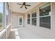 Cozy screened-in porch with outdoor access and a ceiling fan at 1374 Highland Wood Ct, Auburn, GA 30011