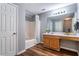 Full bathroom with wood look floors, vanity, shower and tub combo at 208 Oconee Way, Canton, GA 30114