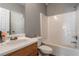Bathroom featuring a single sink vanity, toilet, and a shower-tub combination at 208 Oconee Way, Canton, GA 30114
