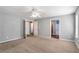 Huge bedroom with neutral carpet, and multiple closets and entry doors at 208 Oconee Way, Canton, GA 30114