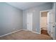 Bedroom view with a connected bathroom and a clean and simple design with neutral colors at 208 Oconee Way, Canton, GA 30114
