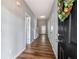 Inviting entryway with wood flooring, neutral walls, and a view leading into the home at 208 Oconee Way, Canton, GA 30114