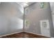 Open living area featuring high ceilings, hardwood floors, and abundant natural light at 208 Oconee Way, Canton, GA 30114