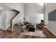 Spacious living room with soaring ceilings, wood floors, and stylish contemporary furnishings at 208 Oconee Way, Canton, GA 30114