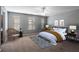 Nicely decorated primary bedroom with area rug and sitting area at 208 Oconee Way, Canton, GA 30114