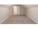 Finished attic featuring neutral walls, carpeted floors, and storage space at 260 Pleasant Grove Cir, Mcdonough, GA 30252