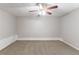 Finished basement with neutral walls, new carpet, and a ceiling fan at 260 Pleasant Grove Cir, Mcdonough, GA 30252