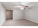 Spacious basement with painted brick and carpeted floor at 260 Pleasant Grove Cir, Mcdonough, GA 30252