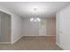 Finished basement with modern light fixture and door to the exterior at 260 Pleasant Grove Cir, Mcdonough, GA 30252