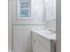 Updated bathroom featuring painted brick wall and modern vanity at 260 Pleasant Grove Cir, Mcdonough, GA 30252