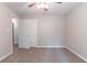 Neutral bedroom offering neutral walls, plush carpet, and white doors at 260 Pleasant Grove Cir, Mcdonough, GA 30252