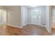 Inviting foyer featuring stylish flooring and a beautiful front door that fills the space with natural light at 260 Pleasant Grove Cir, Mcdonough, GA 30252