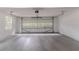 Spacious two-car garage with concrete flooring, white walls, and natural light at 260 Pleasant Grove Cir, Mcdonough, GA 30252