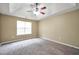 Expansive bedroom with carpeted floors, ceiling fan, and natural light at 502 Gallantry Trl, Mcdonough, GA 30252