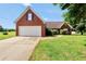Charming brick home with a well-manicured lawn and attached two-car garage, perfect for suburban living at 502 Gallantry Trl, Mcdonough, GA 30252