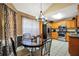 Kitchen features stainless steel appliances, granite countertops, and adjacent dining area at 502 Gallantry Trl, Mcdonough, GA 30252