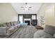 Spacious living room with a fireplace, plush seating, and stylish decor for comfortable relaxation and entertainment at 502 Gallantry Trl, Mcdonough, GA 30252