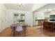 The bright dining area is open to the kitchen and includes sliding doors to the porch at 9685 Cone Ct, Roswell, GA 30075