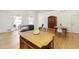 Open-concept kitchen features a large island with seating and hardwood floors at 9685 Cone Ct, Roswell, GA 30075