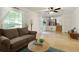 Bright living room featuring hardwood floors, and stairs to a second floor at 9685 Cone Ct, Roswell, GA 30075