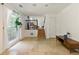 Spacious living room with tile floors, stairs to the second floor, and a large window at 9685 Cone Ct, Roswell, GA 30075