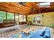 Covered porch featuring a porch swing, comfortable seating, and ceiling fans for ideal relaxation and leisure at 9685 Cone Ct, Roswell, GA 30075