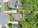 Aerial view showcases a home with a private pool, surrounded by lush greenery and neighborhood streets at 127 Sanctuary Ave, Woodstock, GA 30188