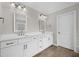 Bright bathroom featuring dual sinks, white cabinetry and tile flooring at 127 Sanctuary Ave, Woodstock, GA 30188