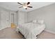 Comfortable bedroom featuring a ceiling fan, neutral color palette, and plush carpeting at 127 Sanctuary Ave, Woodstock, GA 30188