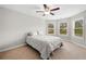 Bedroom featuring carpet, ceiling fan and multiple windows at 127 Sanctuary Ave, Woodstock, GA 30188