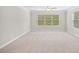 Empty bedroom has new carpet and lots of light at 127 Sanctuary Ave, Woodstock, GA 30188
