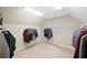Spacious walk-in closet with ample shelving and hanging space at 127 Sanctuary Ave, Woodstock, GA 30188