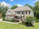 Beautiful two-story home boasts an attached two-car garage and a professionally landscaped yard at 127 Sanctuary Ave, Woodstock, GA 30188