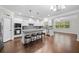 Bright open concept kitchen with a large island, stainless appliances, and hardwood floors at 127 Sanctuary Ave, Woodstock, GA 30188