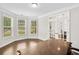 Inviting living room filled with natural light, showcasing French doors and hardwood floors at 127 Sanctuary Ave, Woodstock, GA 30188