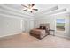 Bright main bedroom with a tray ceiling, carpeted floor, and a serene atmosphere at 127 Sanctuary Ave, Woodstock, GA 30188