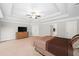 Expansive main bedroom featuring a tray ceiling, double closets and ample space at 127 Sanctuary Ave, Woodstock, GA 30188