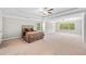 Spacious main bedroom with tray ceiling, lots of carpet and natural light at 127 Sanctuary Ave, Woodstock, GA 30188